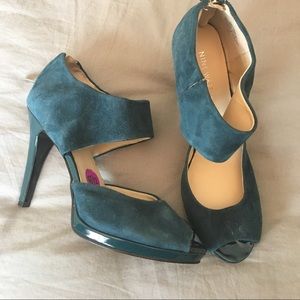 Emerald suede peep toe shoes.